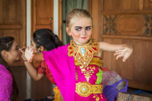 A family immersing in Balinese culture and dance at Citakara Sari Estate in Bali